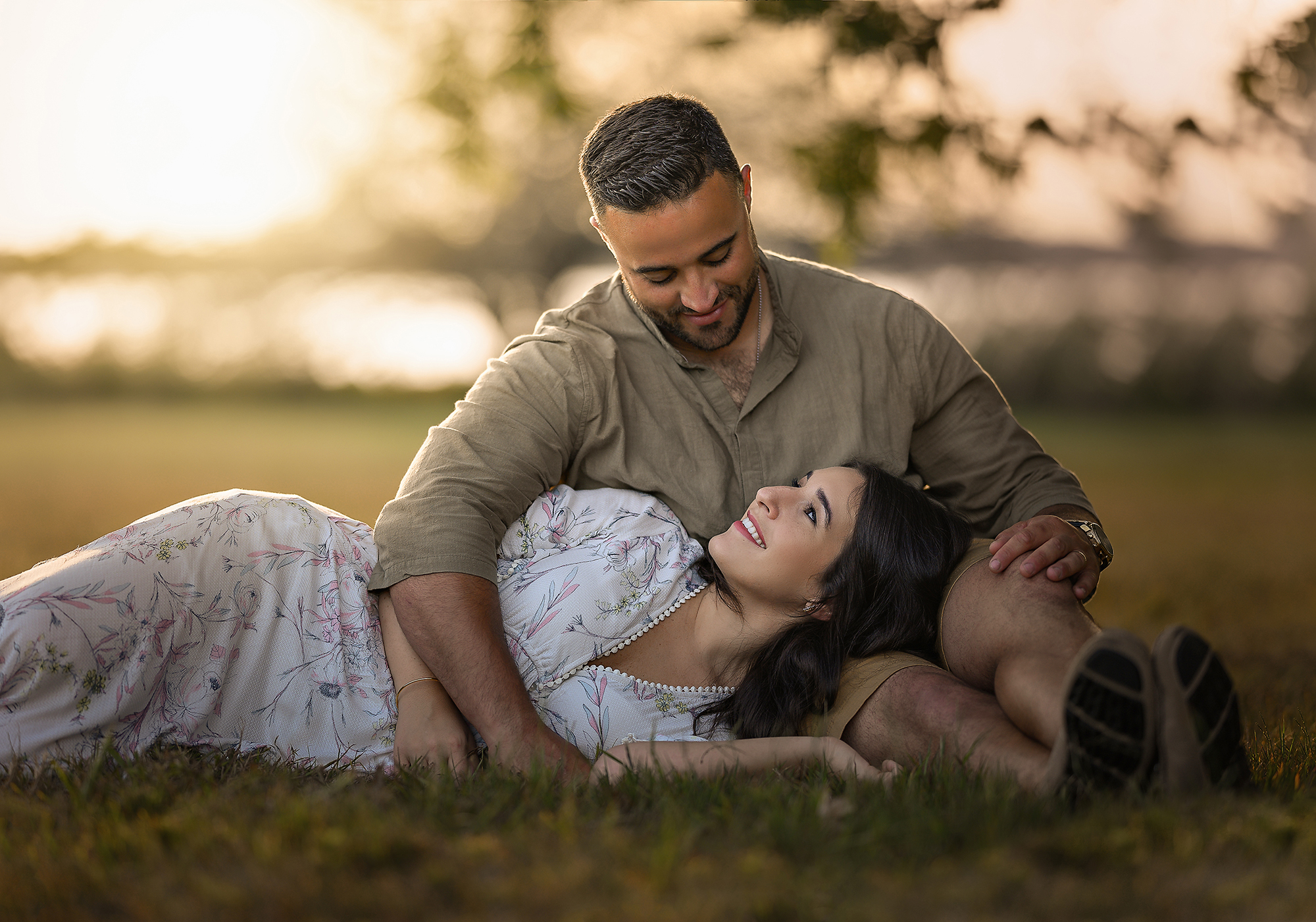 woman laying on husband in a field spas in virginia beach